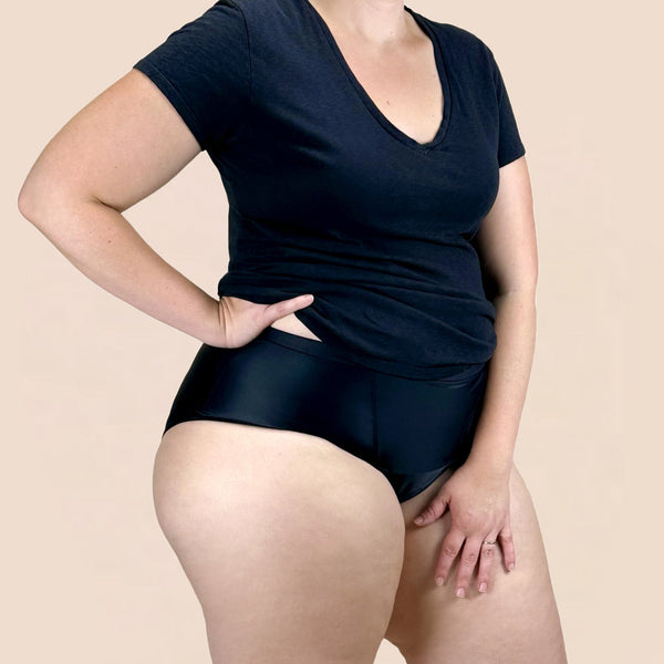 Side view of woman wearing Hem Support Wear High-Waisted Brief pelvic floor support underwear in black