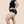 A model shown from the side wearing Hem Support Wear's high waisted brief pelvic floor support underwear in size 1x.
